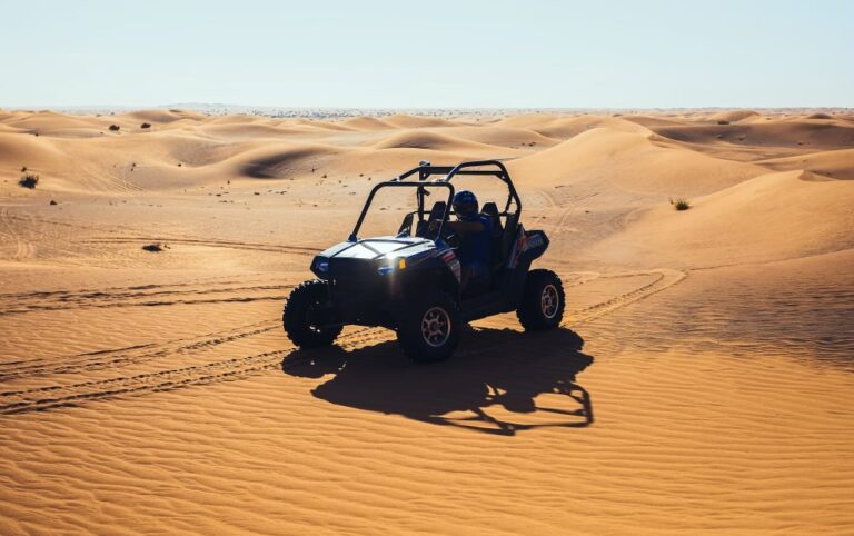 quad-buggy-car-sand-dunes-with-sun-flare-headlight-have-fun-extreme-dubai-safari-tour